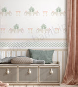 Decorative wallpaper with elephant and plant pattern, bench with cushions, and pink curtain.