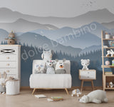 Children's room with mountain mural, furniture, and toys.