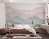 Modern bedroom with a mountain mural on the wall, featuring a bed, desk, and decorative items.