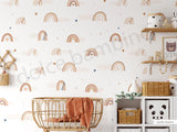 A room with walls covered in a wallpaper featuring Nordic pastel rainbows, fluffy clouds, and heart-shaped confetti.