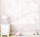 White nightstand with lamp against a pink floral wallpapered wall.
