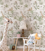 Kids room featuring safari wallpaper with elephants, giraffes, and tropical leaves, paired with natural wood furniture.