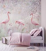 A bedroom wall mural featuring a group of flamingos in a garden setting with greenery and a white bear-like figure, likely a teddy bear, on a bed.