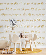 Children's room with beige wallpaper featuring a repeating pattern of safari animals like lions, zebras, and elephants in gold tones.