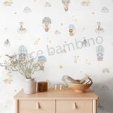 A wall adorned with colorful, playful wallpaper featuring various whimsical characters and a rainbow-colored balloon.
