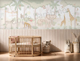 Hand-illustrated safari wallpaper with giraffes, elephants and monkeys in a kids’ room