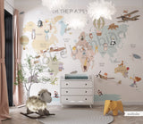 Children's room featuring a colorful world map wallpaper with illustrations of animals and vehicles. A wooden dresser and a canvas storage basket are visible in the room.