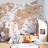 Children's room with a wall mural featuring a world map with animals and hot air balloons in a scandinavian style.