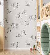 Children's room with soccer-themed wallpaper and wooden bunk bed.