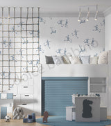 Children's bedroom with a soccer themed wallpaer,bunk bed, and toys.