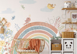 Children's room with a rainbow mural, crib, and shelves with decorative items.