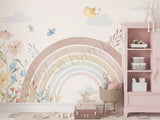 A-list Bollywood actress Soha Ali Khan's Daughter's bedroom with a rainbow mural, floral decorations, and a pink bookshelf.