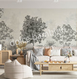 Modern living room styled with Dolce Bambino’s Lush Forest wallpaper featuring elegant forest scenery and nature-inspired details.
