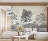 Modern living room styled with Dolce Bambino’s Lush Forest wallpaper featuring elegant forest scenery and nature-inspired details.