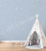 A children's playroom featuring a wall with a star-patterned wallpaper.