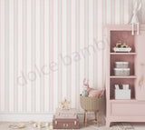 Children's room with striped pattern wallpaper,pink bookshelf, and toys.