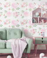 Living room with floral wallpaper, green sofa, and small table.