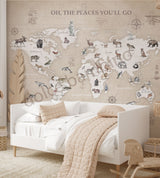 A wall mural featuring a world map with Scandinavian style watercolor designs, shown in an interior setting with a bed and decorative items.
