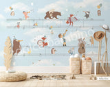 A wall mural featuring various cartoon animals playing musical instruments, with a musical staff background.