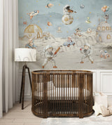 Wooden crib in a room with space-themed wall mural