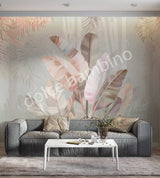 A section of wallpaper with a floral pattern featuring banana leaves in pink and green shades, and coconut tree leaves in the background, applied on a wall in a living room setting.