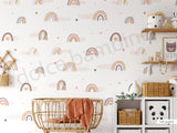 A room with walls covered in a wallpaper featuring Nordic pastel rainbows, fluffy clouds, and heart-shaped confetti.