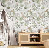 Kids room featuring safari wallpaper with elephants, giraffes, and tropical leaves, paired with natural wood furniture.
