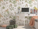 Kids room featuring safari wallpaper with elephants, giraffes, and tropical leaves, paired with natural wood furniture.