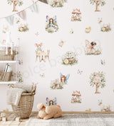 Children's room with fairy-themed wallpaper and toys.