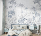 Children's bedroom with jungle-themed wallpaper featuring elephants, giraffes, and zebras.
