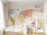 A multicolored world map wall mural in a children's room, with the phrase 'OH, THE PLACES YOU'LL GO' at the top.