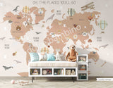 Children's room with a wall mural featuring a world map with animals and hot air balloons in a scandinavian style.