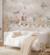 Children's bedroom with a white bed, decorative wall mural, and wooden toys.
