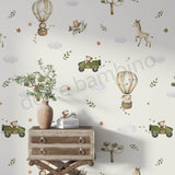 A whimsical wallpaper featuring cars and jungle animals in a playful design, displayed in a children's room with a wooden furniture,and decorative items.