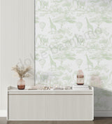 Room interior with a console table against a wall with green abstract animal pattern wallpaper.