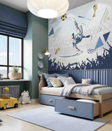 Children's bedroom with sports-themed wall mural and bed.