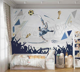 Children's bedroom with a soccer-themed wall mural and bedding.