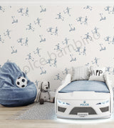 Children's room with soccer themed wallpaper,bed,and bean bag.