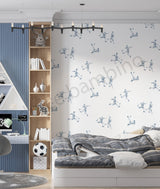 Children's room with soccer-themed wallpaper, bookshelf, and bed.