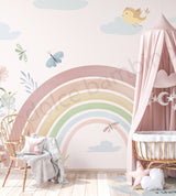 A-list Bollywood actress Soha Ali Khan's Daughter's bedroom with pastel rainbow wall mural, crib, and decorative elements.