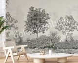 Decorative lush floral wall mural with trees in a room with a chair and lamp.