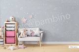 A children's playroom featuring a wall with a star-patterned wallpaper.