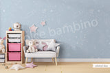 A children's playroom featuring a wall with a star-patterned wallpaper.