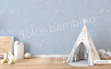 A children's playroom featuring a wall with a star-patterned wallpaper.