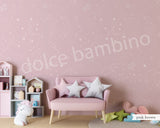 A children's playroom featuring a wall with a star-patterned wallpaper.