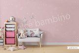 A children's playroom featuring a wall with a star-patterned wallpaper.