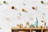 A wall adorned with whimsical seamless wallpaper featuring teddy bears, balloons, and stars in a nursery room setting.