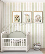 Nursery room with striped wallpaper,white crib, framed animal prints on the wall, and a basket labeled 'toys'.