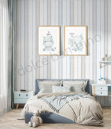 Children's bedroom with striped pattern wallpaper,framed illustrations of a hippo and an elephant on the wall.