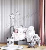 Children's room with striped pattern wallpaper,a crib, toys, and decorative elements.